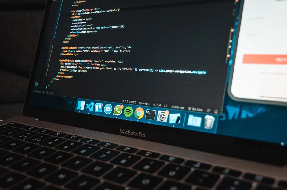 A modern computer screen displaying web design work, showcasing creative visuals in a workspace.